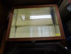 A wooden framed glass display cabinet