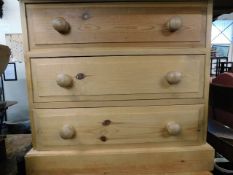 A pair of stripped pine drawers