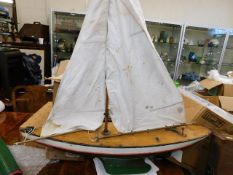 A mid 20thC. model yacht with faults to rigging