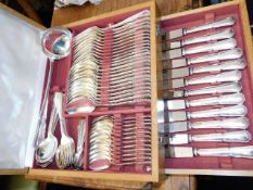 A wooden canteen of silver plated cutlery