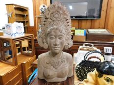An Asian carved bust