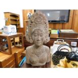 An Asian carved bust