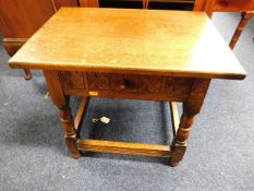 A small oak occasional table with drawer