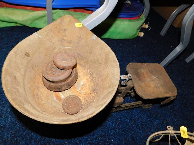 An antique set of scales with weights