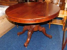 A 19thC. mahogany oval shaped tilt top dining tabl