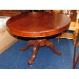 A 19thC. mahogany oval shaped tilt top dining tabl