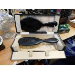 A vintage boxed brush set