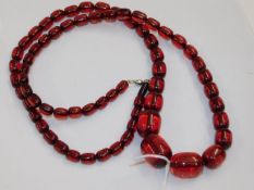 A large set of red amber style beads