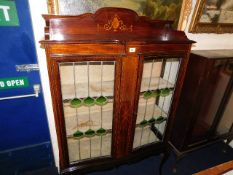 A mahogany display cabinet with art nouveau style