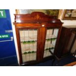 A mahogany display cabinet with art nouveau style