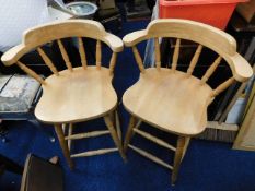 A pair of heavy beech bar stools