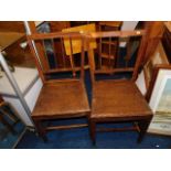 A pair of oak seated farmhouse chairs