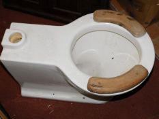 An early 20thC. toilet with cistern & fittings ori
