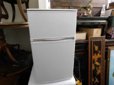 A modern under worktop fridge freezer