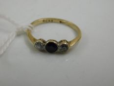 A 9ct gold ring set with sapphire & white stone
