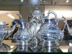 An antique three piece silver plated coffee servic