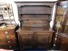 A stained solid wood antique style dresser