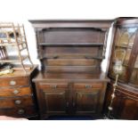 A stained solid wood antique style dresser