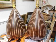 A pair of wooden lamp bases