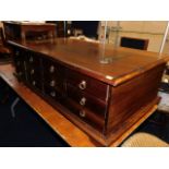 A unusual solid wood coffee table set with hinged