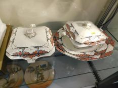 Two art deco tureens, repairs to handles, with sta