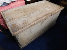 An antique pine storage box with lift off lid