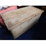 An antique pine storage box with lift off lid