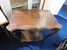 An Edwardian mahogany table twinned with one other