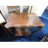 An Edwardian mahogany table twinned with one other