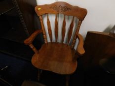 A farmhouse kitchen style carver chair