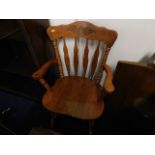 A farmhouse kitchen style carver chair