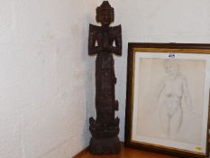 A carved figure of religious interest twinned with