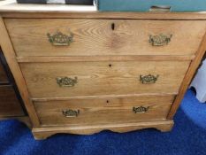 An antique low level oak chest of drawers