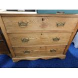 An antique low level oak chest of drawers