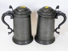 A pair of 19thC. lidded pewter tankards