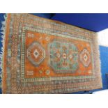 An Indian wool carpet 87in x 56in