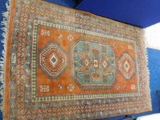 An Indian wool carpet 87in x 56in