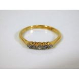 An 18ct gold five stone diamond ring 2.1g