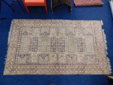 A large middle eastern style silk rug 98in x 57in