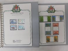 Two Stanley Gibbons Falkland Island stamp albums,