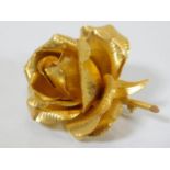 A fine 1960 18ct gold Cartier rose brooch with its