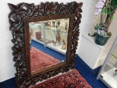 A large mirror approx. 35.5in x 31.5in with heavil