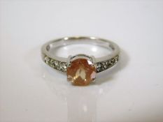 A 9ct white gold ring with diamond shoulders & cha