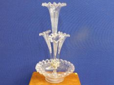 A Victorian glass epergne with one large centre fl