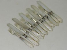 A set of six mother of pearl handled knives & fork