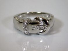 A good quality platinum & diamond buckle ring et w