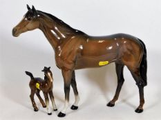 A Beswick stallion & foal