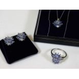 A 9ct white gold & tanzanite ring, earring & neckl