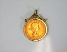 An Elizabeth II full gold sovereign dated 1967 wit