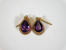 A pair of 9ct set amethyst earrings 2.8g
